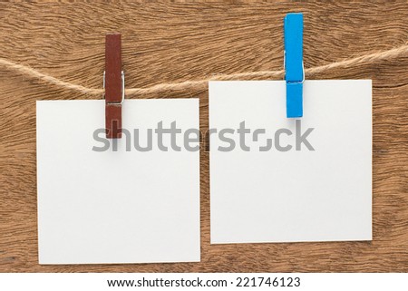 paper clothes peg on a wooden background