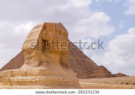 The Great Sphinx including the pyramids of Menkaure and Khafre in the background in Giza, Cairo, Egypt