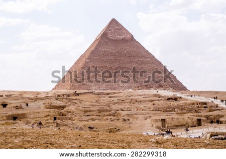 CAIRO - MAY 12 : The pyramids at Giza near Cairo, Egypt on MAY 12, 2015. The Great Pyramid of Khufu is the only one of the Seven Wonders of the Ancient World still in existence.