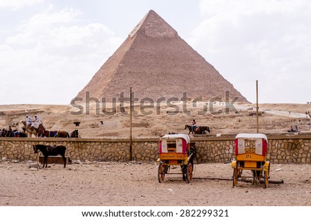 CAIRO - MAY 12 : The pyramids at Giza near Cairo, Egypt on MAY 12, 2015. The Great Pyramid of Khufu is the only one of the Seven Wonders of the Ancient World still in existence.