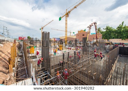 Nakhon Ratchasima, Thailand - June 9, 2015 : Pouring the concrete foundation of the building. June 9, 2015 in Nakhon Ratchasima, Thailand