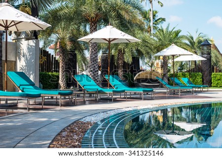 BANGKOK ,THAILAND - NOVEMBER 14 ,2015 : Landscape with pool, pool bed and umbrella in luxury resort in Bangkok.