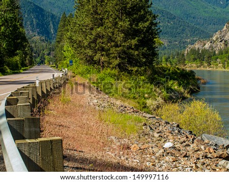 Highway Parallels a Wide Mountain River - Clark Fork River Montana USA