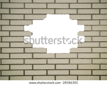 Brick wall background, with large white hole, in various shades of gray and white.