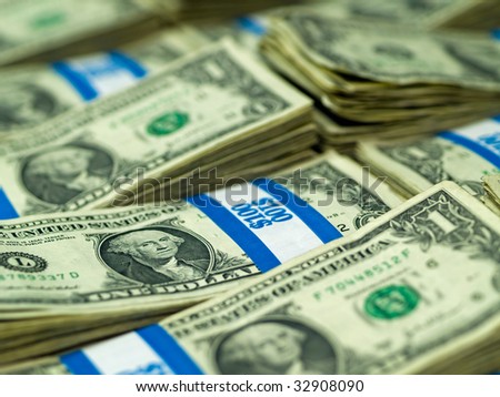 Hundred dollar bundles of U.S. One Dollar bill laid out as a background