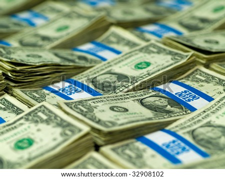 Hundred dollar bundles of U.S. One Dollar bill laid out as a background