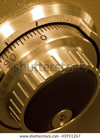Closeup of a Safe Vault Combination Spinner - Gold Toned