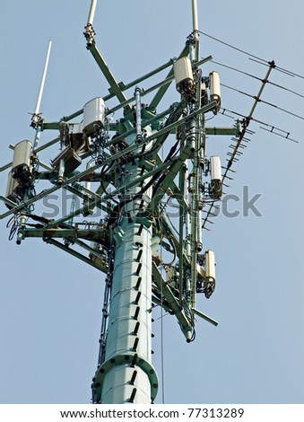 Single Communication Tower Over a Blue Sky