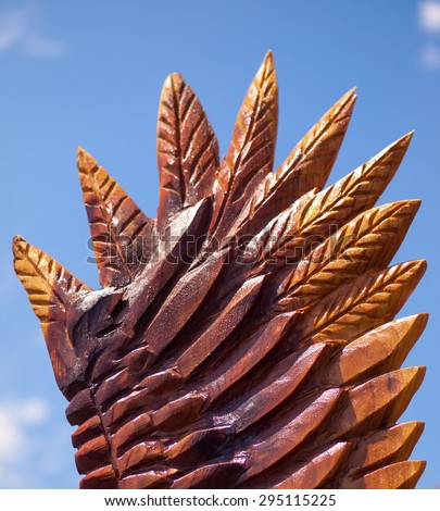 Closeup of an Eagle Wing Chainsaw Sculpture Showing Carved and Burned Wood