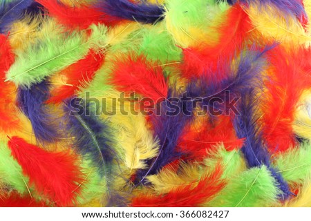 Background - small red, blue, green, yellow plumes situated irregularly