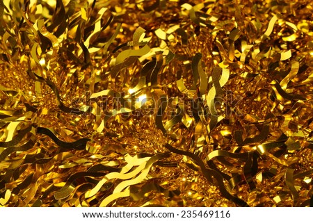 Striking golden ribbons for Christmas and Chinese New Year decorations / Christmas & Chinese New Year celebrations / golden backgrounds