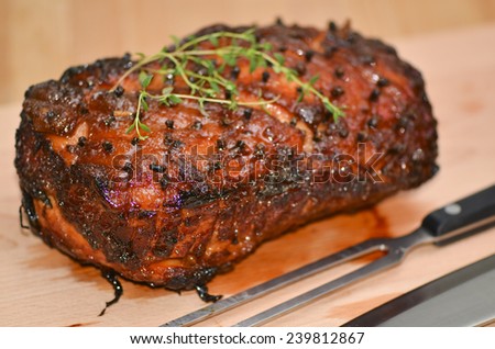 Homemade honey glazed gammon ham with traditional herbs and spices / Christmas ham / Cooked meat for festive seasons
