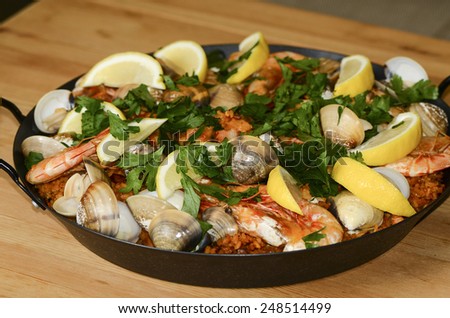 Home cooked chicken spanish paella with seafood toppings / Spanish paella / Easy and simple to prepare, favorite choice for many household