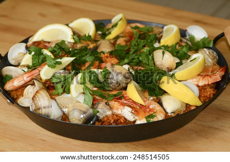 Home cooked chicken spanish paella with seafood toppings / Spanish paella / Easy and simple to prepare, favorite choice for many household
