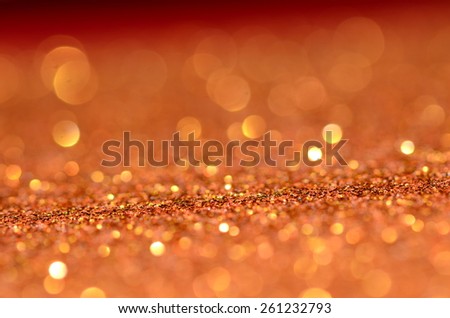 Dreamy and defocused golden lights, circles and bubbles with glittering golden background / Abstract background / Ideal for festive, holiday and promotional background
