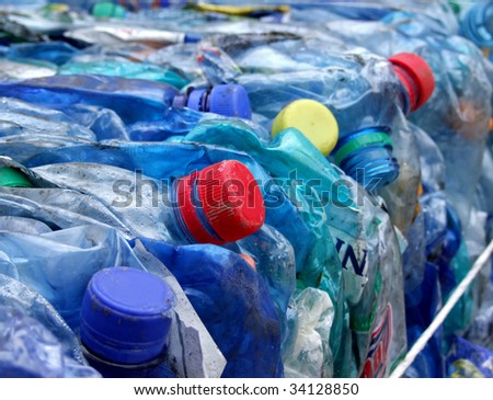 Old dark blue plastic bottles prepared for processing and recycling
