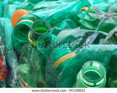 Old green plastic bottles prepared for processing and recycling