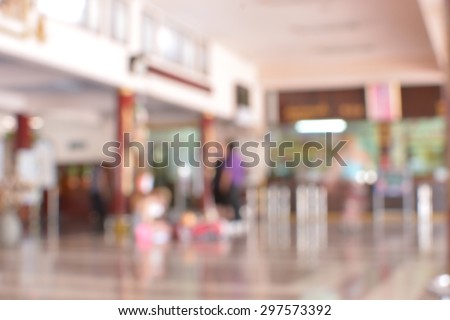 blur passengers wait for train station