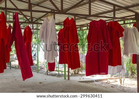 Red robes of monks red robes of monks, dried under a pergola, Yangon.
