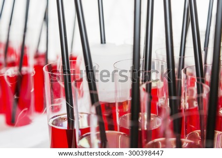 Welcome drinks - red drink molecular gastronomy, selective focus