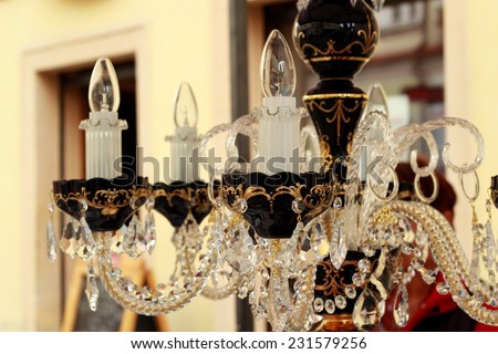 crystal chandelier at the flea market on the doors background/crystal chandelier