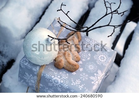 gift on snow covered bench /gift on snow covered bench