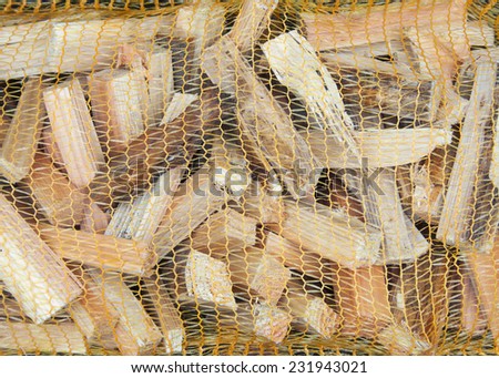 Kindling wood in mesh bag background
