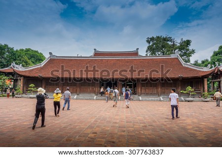 Hanoi, Vietnam - July 28, 2015 : tourists visiting the main house of Van Mieu, Temple of Literature, a famous monument in Hanoi