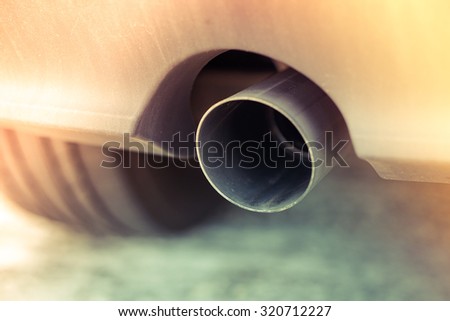 Car pipe exhaust muffler rejecting carbon dioxide. Slide leak vintage style
