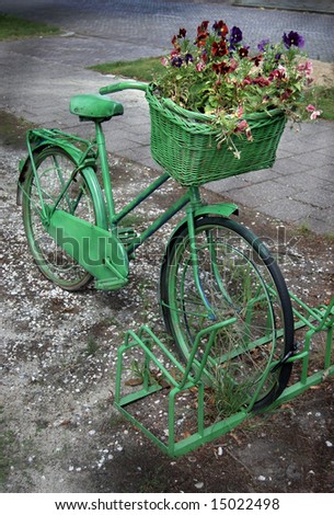 Painted Old Bicycle with a Basket Full of Flowers