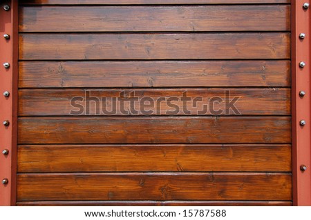 Steel frame and wooden planks; close-up of an antique train wagon
