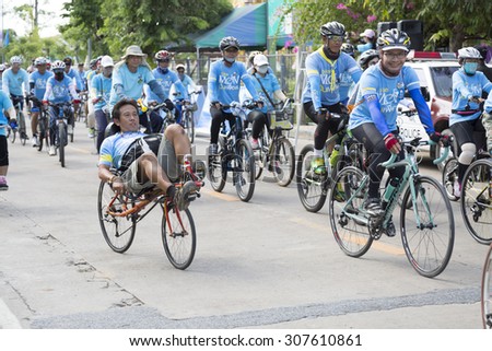 UTHAI-THANI,THAILAND-AUGUST 16,2015 : Unidentified Cyclist and people in \
