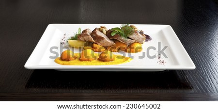 Grilled pork tenderloin with with roast pumpkin, beetroot, roast potatoes and mousse
