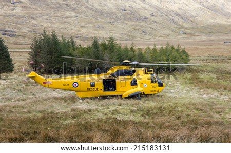 Glen Dessary, Scottish Highlands, UK - APRIL 30: RAF Sea King helicopter XZ588 in front of A\'Chuil bothy on April 30, 2012 at Glen Dessary, Western Highlands.