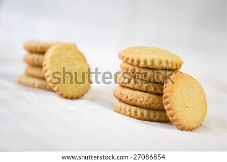 Two stacks of round cookies isolated on white background