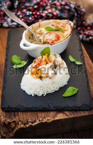 Fish casserole with vegetables in white sauce