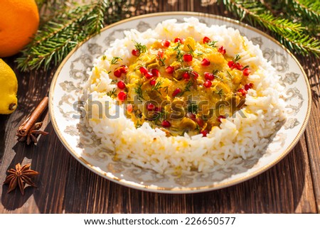 Rice with fish in orange sauce for a Christmas or New Year dinner