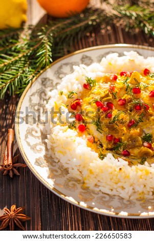 Rice with fish in orange sauce for a Christmas or New Year dinner