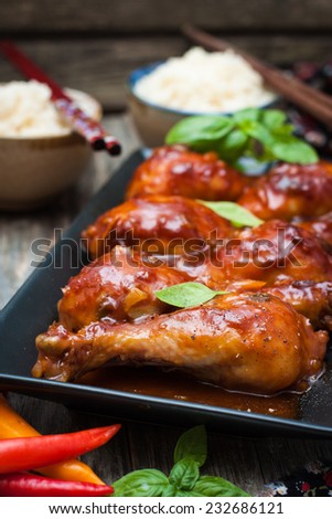 chicken drumsticks in a sweet and sour sauce in Thai
