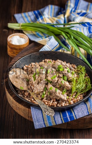 Beef Stroganoff. Beef liver with sour cream and garnish of buckwheat. Russian kitchen. Rustic style