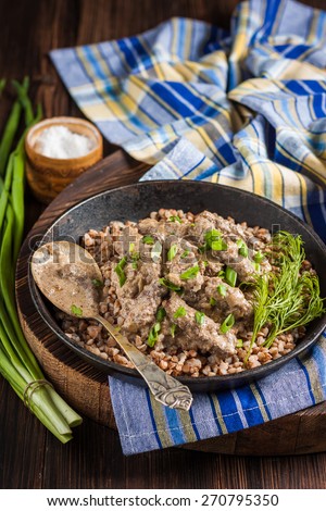 Beef Stroganoff. Beef liver with sour cream and garnish of buckwheat. Russian kitchen. Rustic style