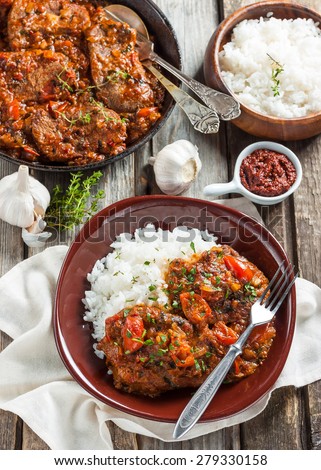 beef in a spicy tomato sauce with rice