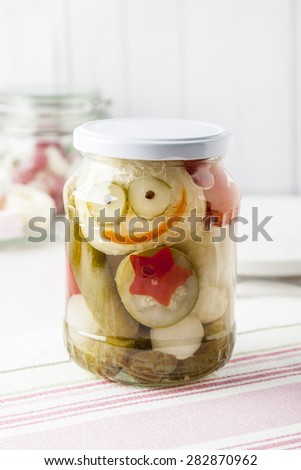 Jar of mixed pickles on kitchen table