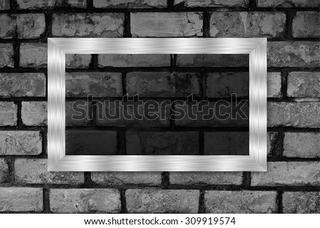 silver frame on the Old grunge brick wall. text box. art