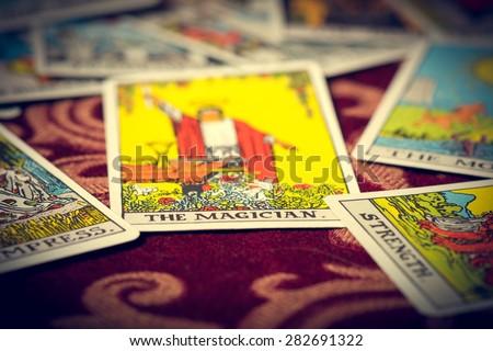 Extreme close-up macro shot of The Magician tarot card with shallow depth of field.