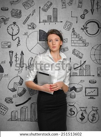 Young pretty woman in office cloth on concrete wall background with business sketches