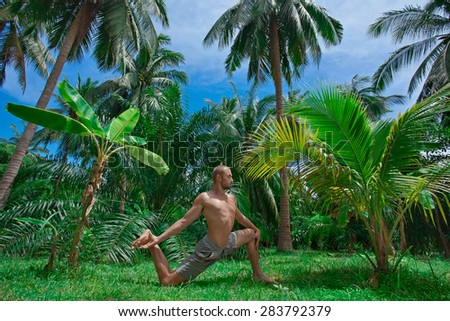 yoga man in tropics