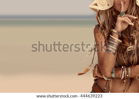 close up of beautiful hippie girl on sea background
