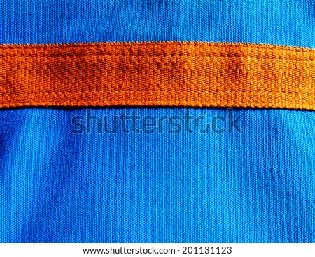 Blue canvas fabric texture with border line of golden brown canvas, texture
