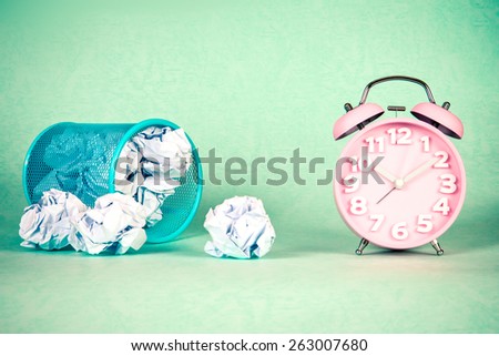 retro and vintage style of Old fashioned the alarm clock and crumpled paper waste  idea